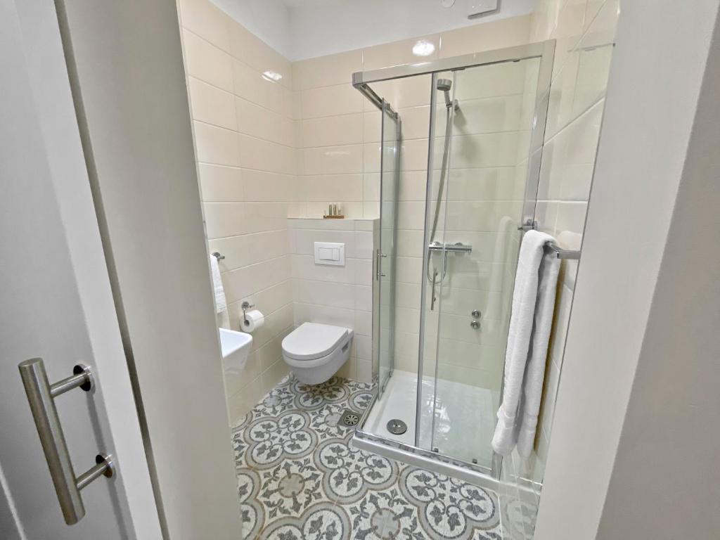 Koupelna v ubytování TOSCANINA Garni Hotel