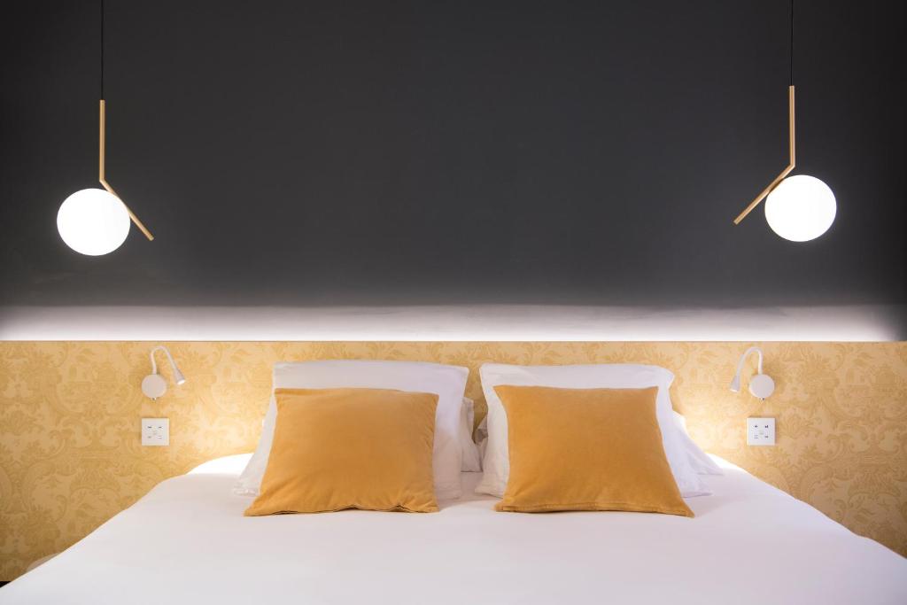 Postel nebo postele na pokoji v ubytování MiHotel Charité