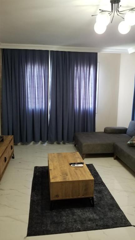a living room with a couch and a coffee table at Huge Evleri 1 in Marmaris
