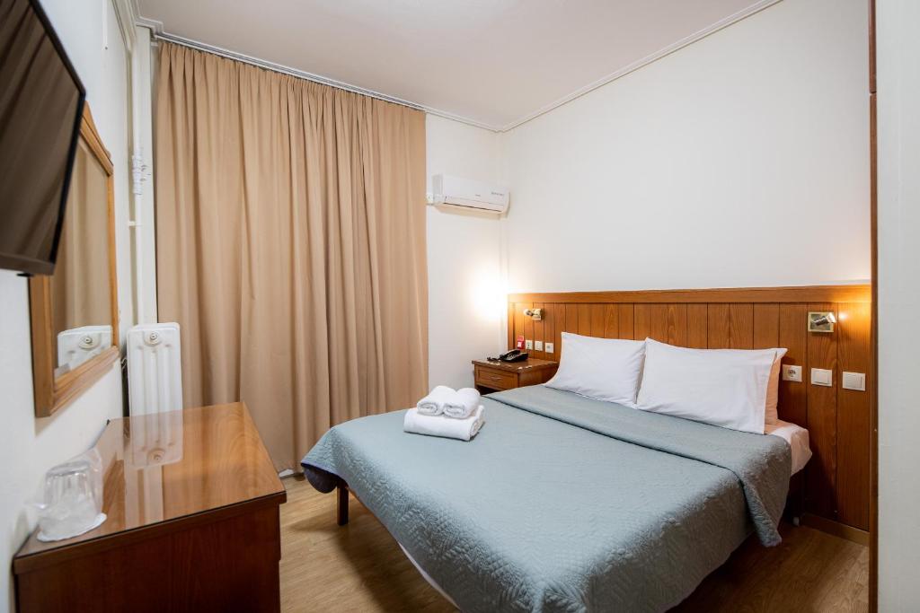 Postel nebo postele na pokoji v ubytování Hotel Philippos
