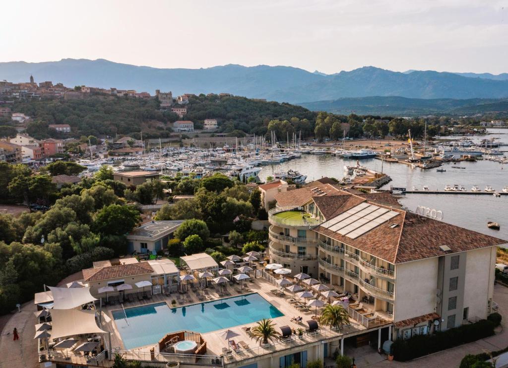 an aerial view of a resort with a marina at Hotel Costa Salina in Porto-Vecchio