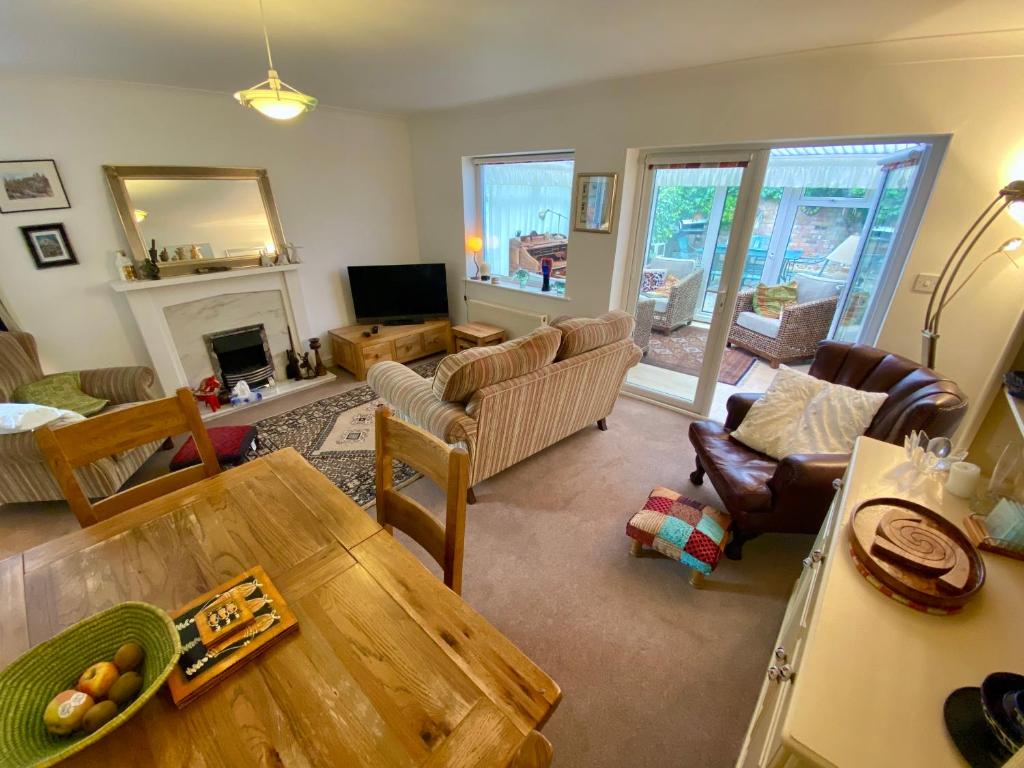 a living room with a couch and a table at Spacious Two Bedroom House - TM in Southport