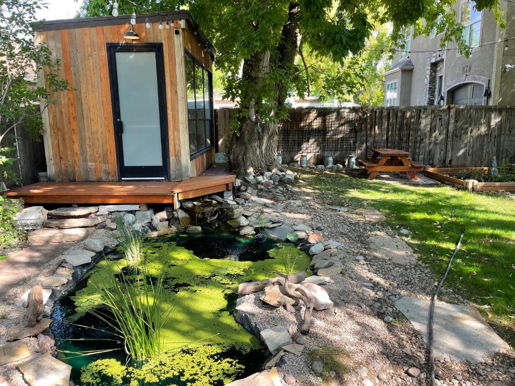 a tiny house with a pond in a yard at 3BD HOME Downtown SLC - Hot Tub - SAUNA-fast wifi in Salt Lake City