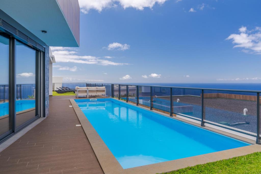 a view of a swimming pool on the balcony of a building at Casa Mozart I in Estreito da Calheta