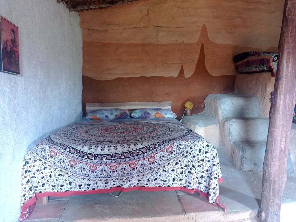 Postelja oz. postelje v sobi nastanitve La Pacha Eco-Finca Glamping