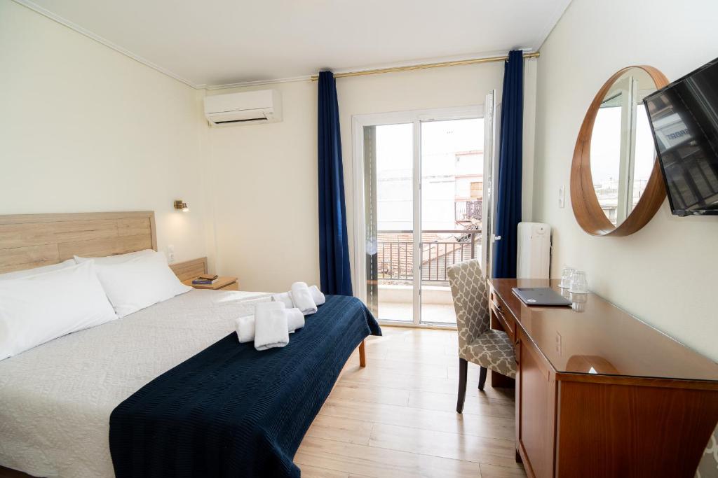 Postel nebo postele na pokoji v ubytování Hotel Philippos