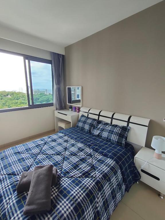 Postel nebo postele na pokoji v ubytování unixx seaview