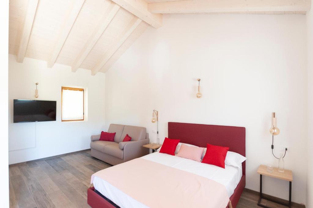 Posteľ alebo postele v izbe v ubytovaní Tenuta Della Casa Wine & Rooms - La Pausa del Collio