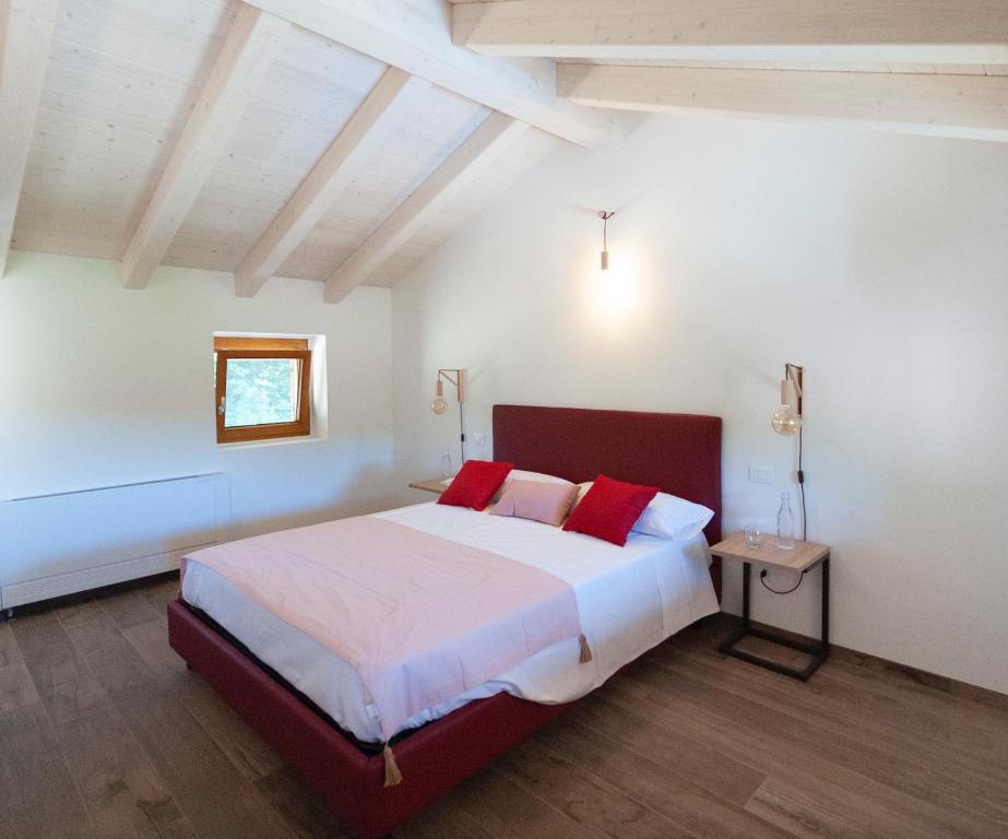 Posteľ alebo postele v izbe v ubytovaní Tenuta Della Casa Wine & Rooms - La Pausa del Collio