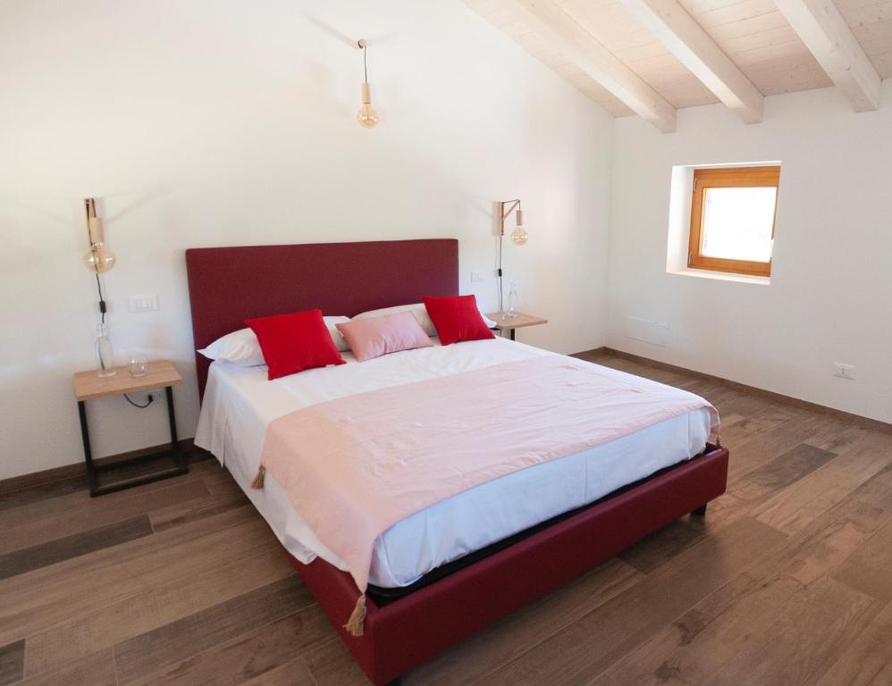 Posteľ alebo postele v izbe v ubytovaní Tenuta Della Casa Wine & Rooms - La Pausa del Collio