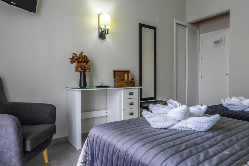 Posteľ alebo postele v izbe v ubytovaní Apartamentos Turísticos El Altozano