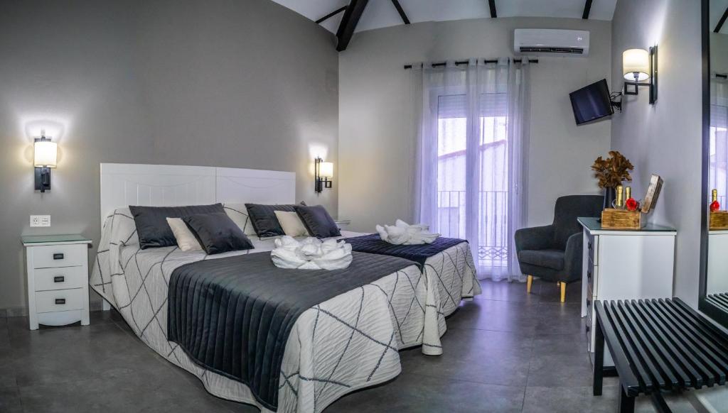 Posteľ alebo postele v izbe v ubytovaní Apartamentos Turísticos El Altozano
