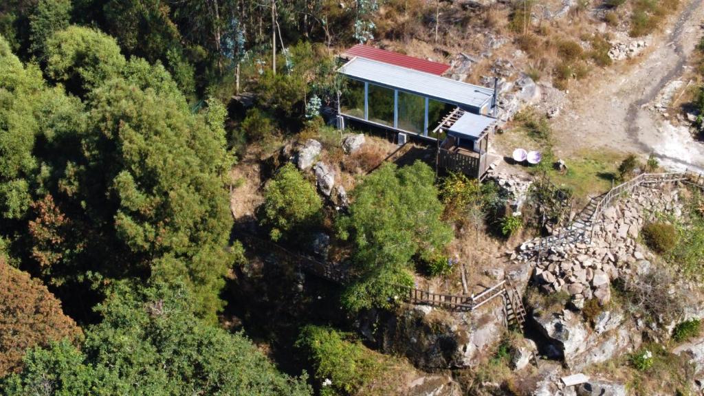 an aerial view of a house on the side of a mountain at GlassHouse - Near River - Near Oporto - Near Ocean in Porto