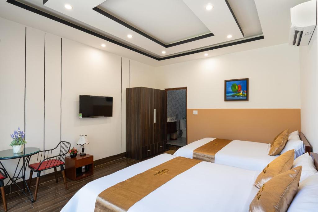 Giường trong phòng chung tại NaFaLa Homestay