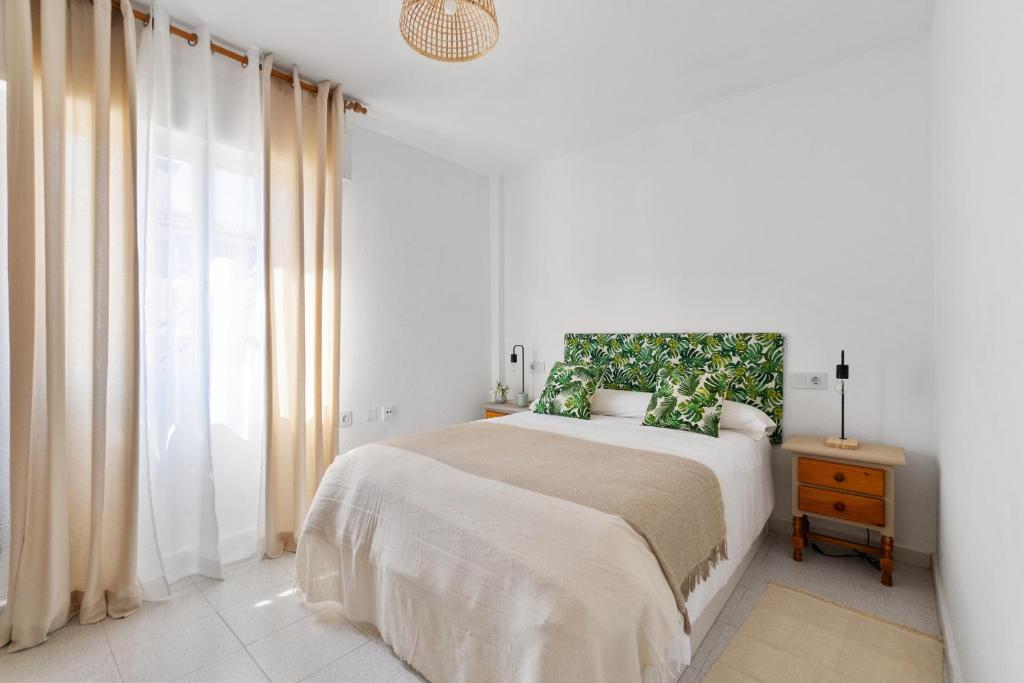 Postel nebo postele na pokoji v ubytování VILLA-CAPRICHO Dunas de la Mata 1