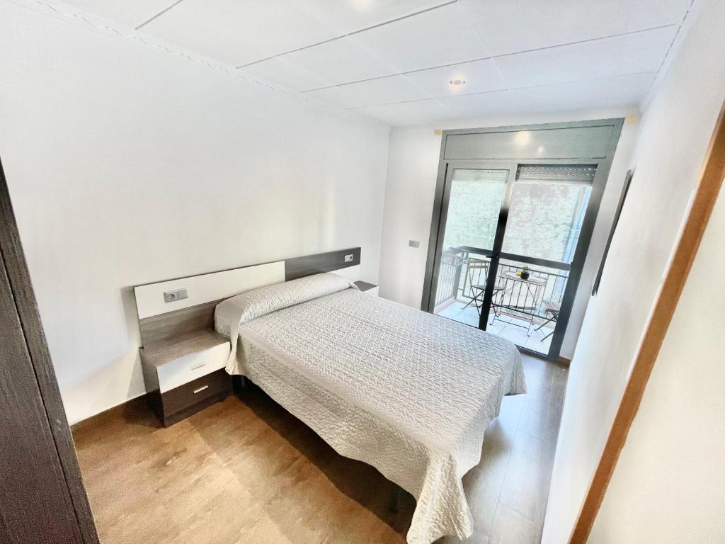 Posteľ alebo postele v izbe v ubytovaní Apartamentos Blanes Petit