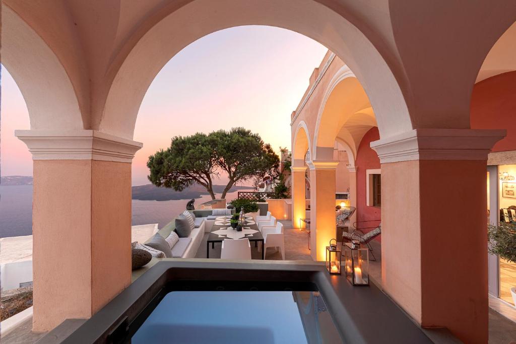 an indoor pool in a villa with a view at Coat of Arms Mansion in Fira