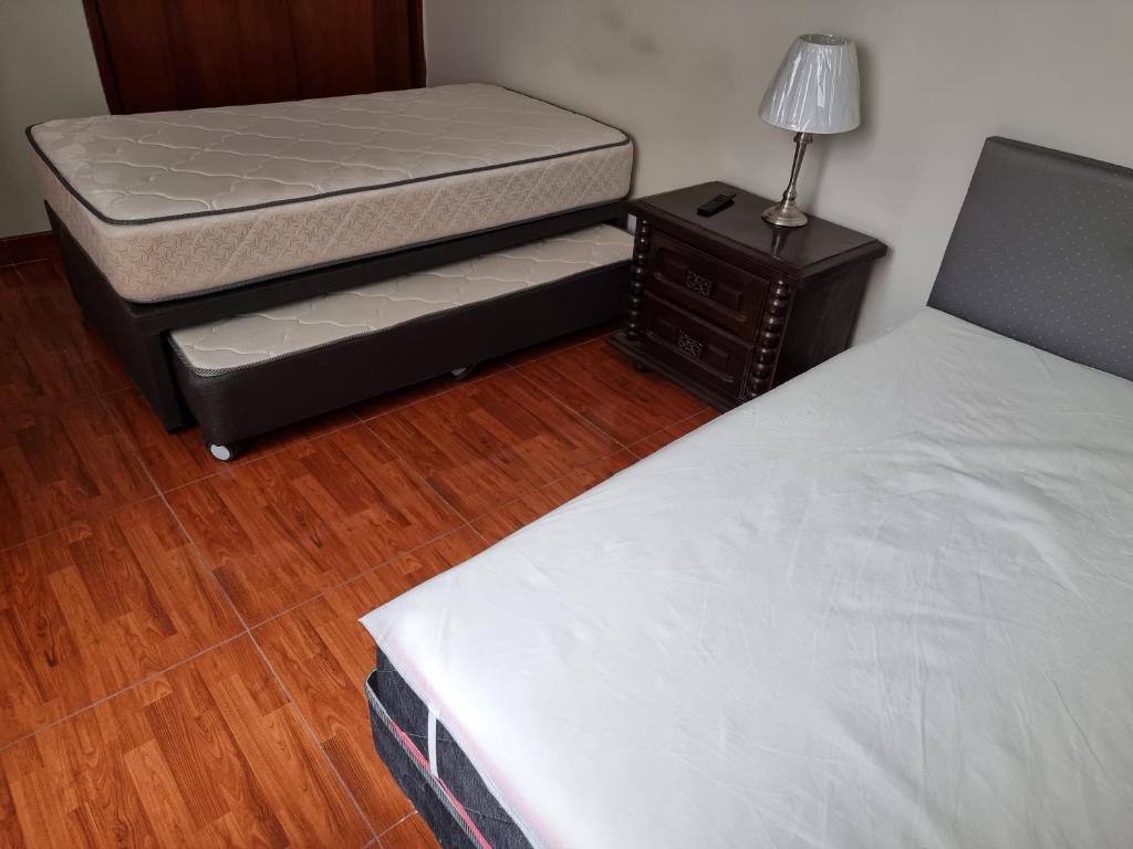 Postel nebo postele na pokoji v ubytování Apart Hotel San Borja