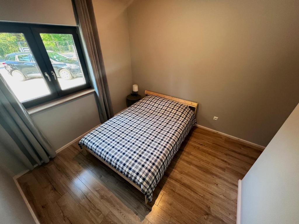 Posteľ alebo postele v izbe v ubytovaní Apartamenty Pod Jaworami