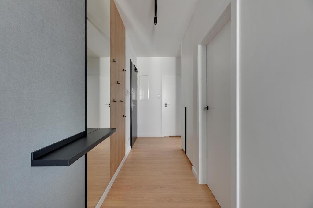 Telewizja i/lub zestaw kina domowego w obiekcie Baltic Lagoon - Okrzei Residence