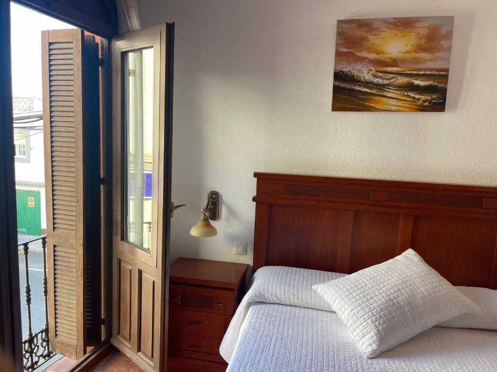 Posteľ alebo postele v izbe v ubytovaní Apartamentos & Rooms JP