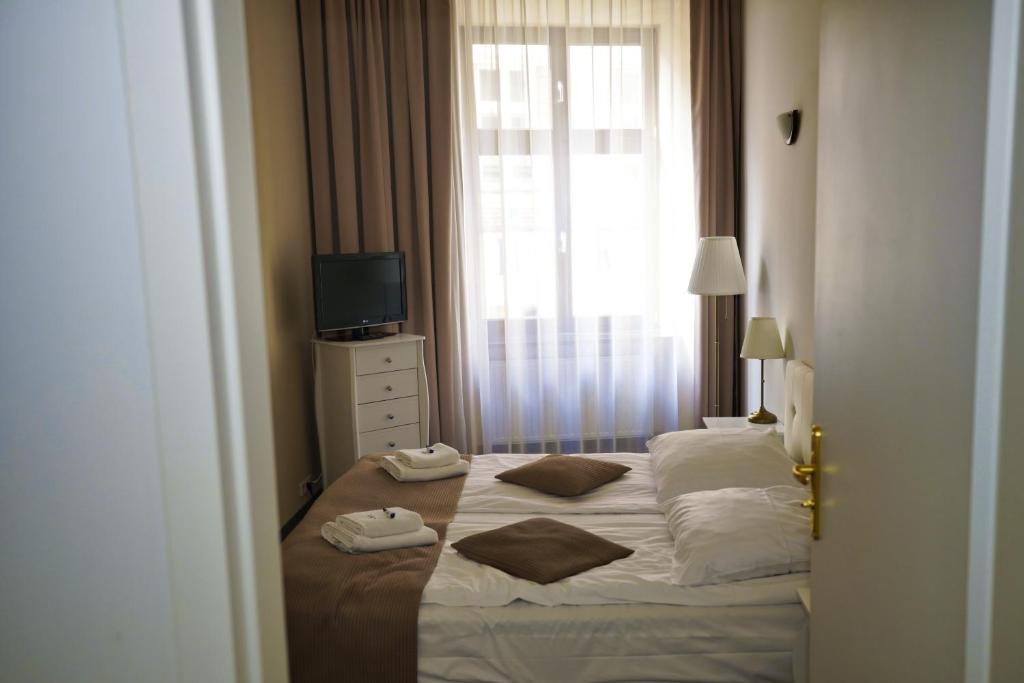 Posteľ alebo postele v izbe v ubytovaní Hotel Wit Stwosz