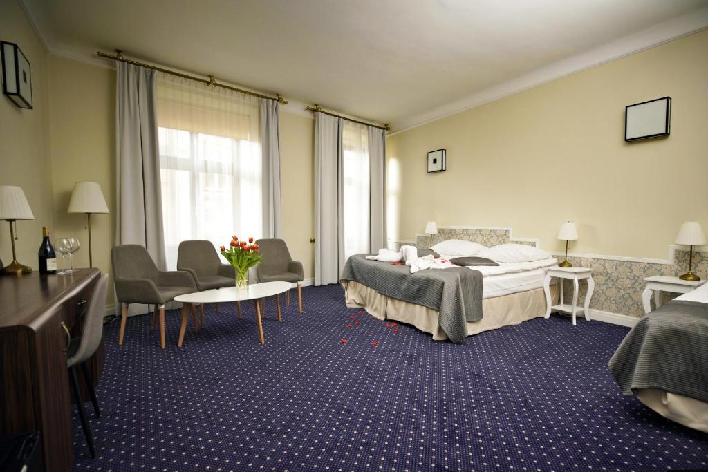 Posteľ alebo postele v izbe v ubytovaní Hotel Wit Stwosz