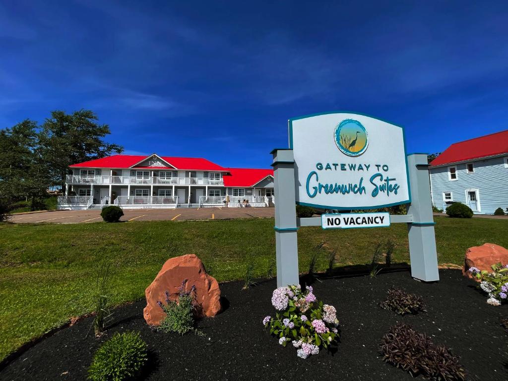 a sign in front of a building with a no vacancy sign at Gateway to Greenwich Suites in Saint Peters