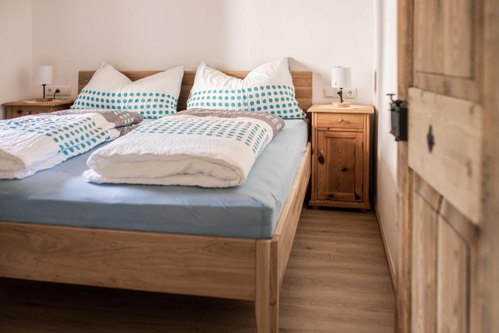 Postel nebo postele na pokoji v ubytování Steinergut Apartments