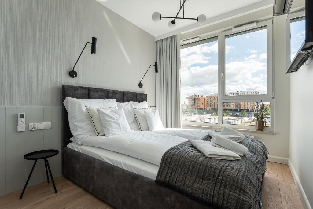 Łóżko lub łóżka w pokoju w obiekcie Apartament Chlebova 314
