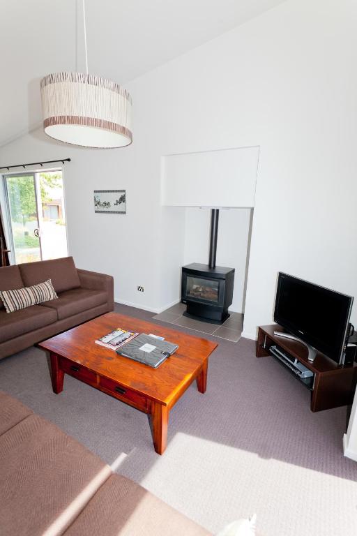 a living room with a couch and a coffee table at Ski Time in Methven