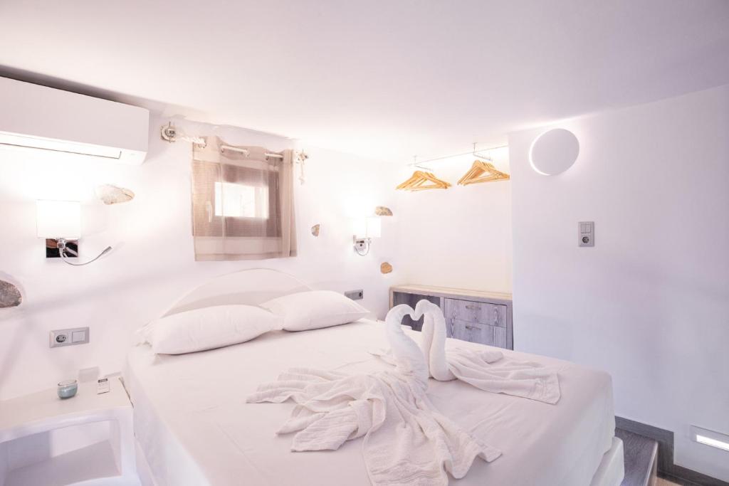 Postel nebo postele na pokoji v ubytování Primrose Apartments