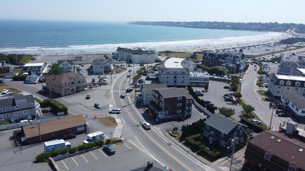 an aerial view of a town with the beach at Rhea's Inn by the Sea in Middletown