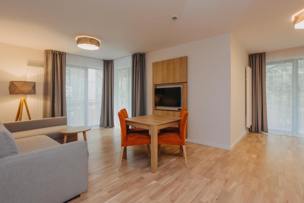 Televízia a/alebo spoločenská miestnosť v ubytovaní Platinum Apartments