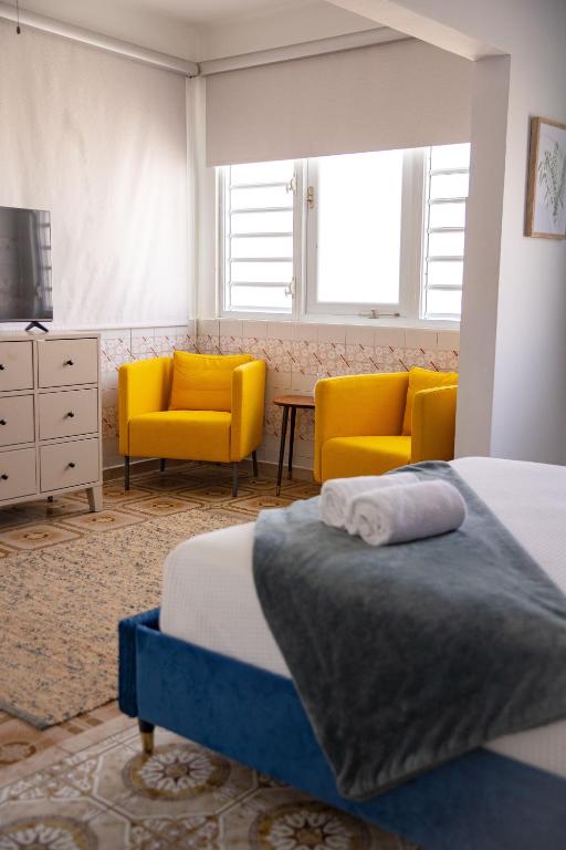 Postel nebo postele na pokoji v ubytování La Buena Vida Inn