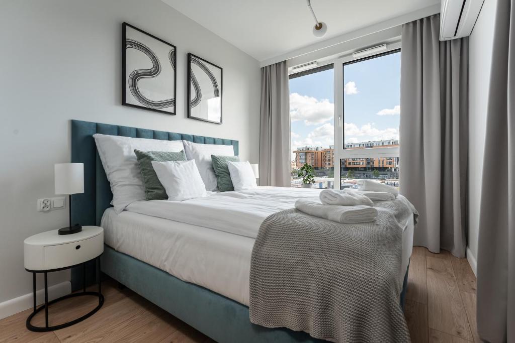 Posteľ alebo postele v izbe v ubytovaní Apartament Chlebova 315