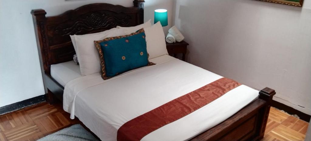 Postel nebo postele na pokoji v ubytování Lajuela BnB & Hostel