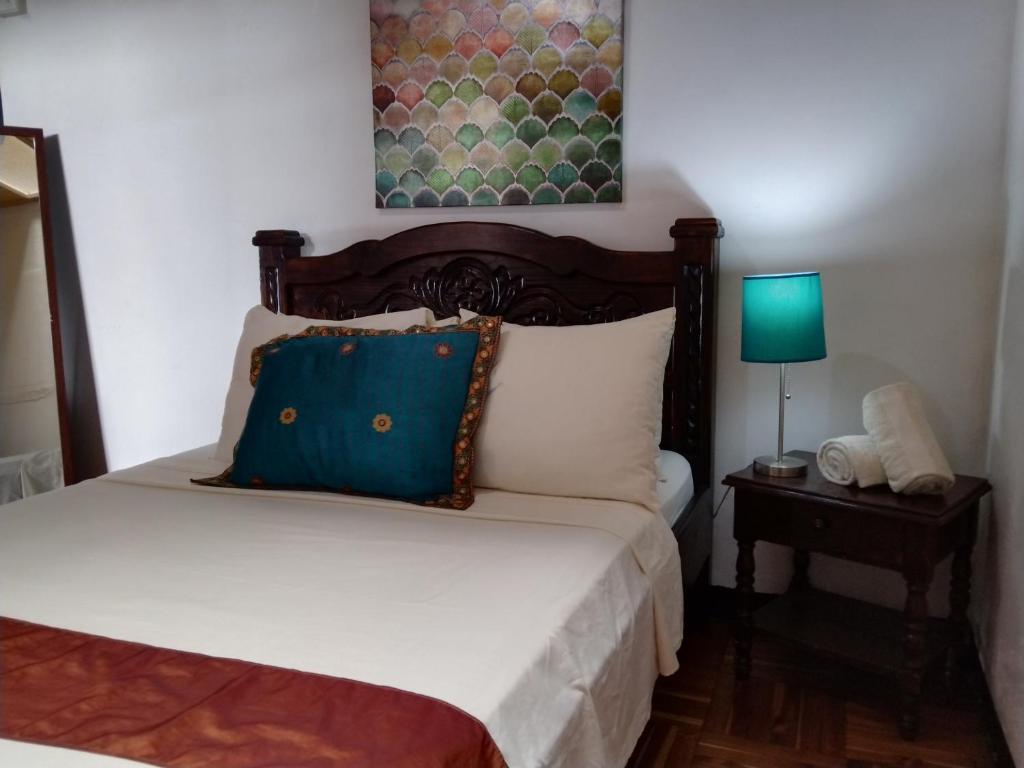 Postel nebo postele na pokoji v ubytování Lajuela BnB & Hostel