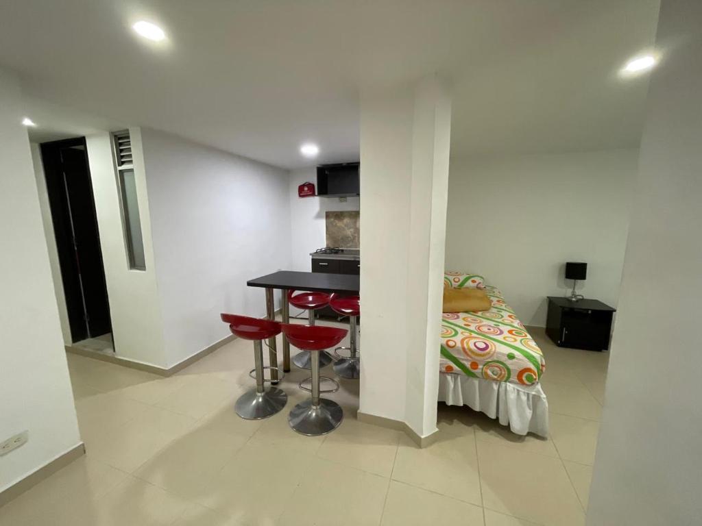 Kuchyň nebo kuchyňský kout v ubytování Lindos apartaestudios y habitaciones en Ibague