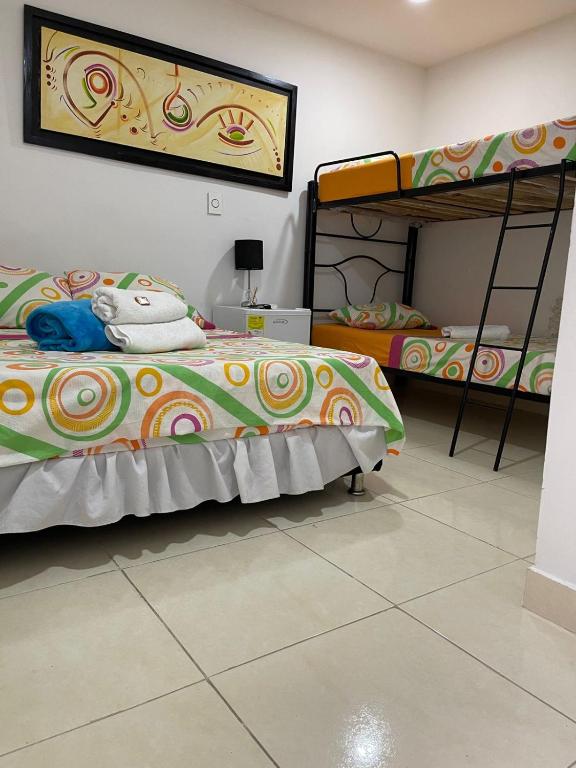 Postel nebo postele na pokoji v ubytování Lindos apartaestudios y habitaciones en Ibague