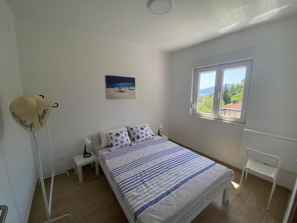 Ένα ή περισσότερα κρεβάτια σε δωμάτιο στο Apartman Aquarelle