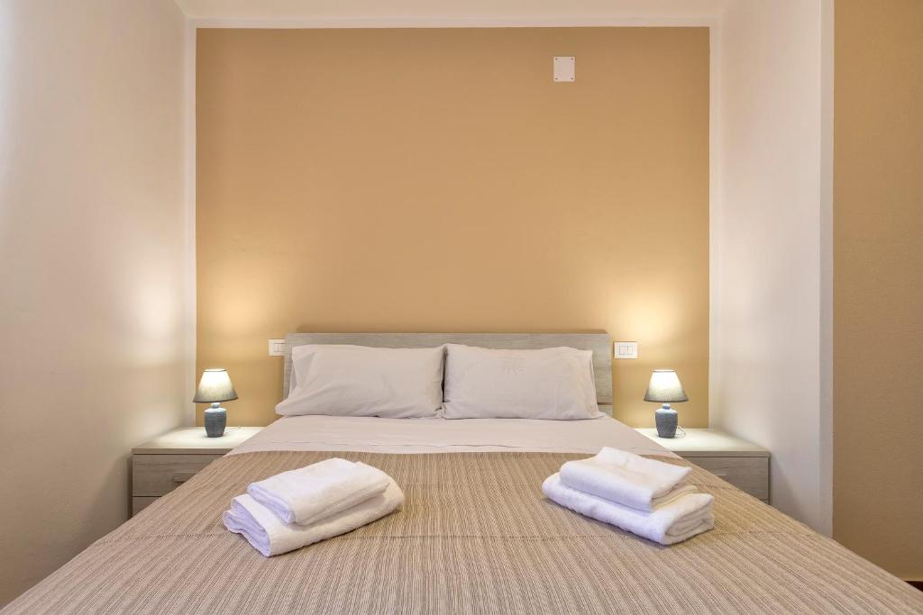 Posteľ alebo postele v izbe v ubytovaní Vico Rooms