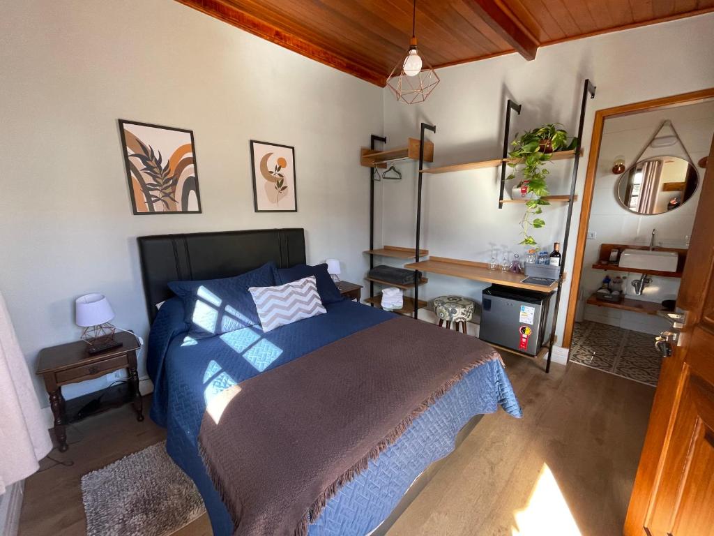 Un pat sau paturi într-o cameră la Paz na Montanha