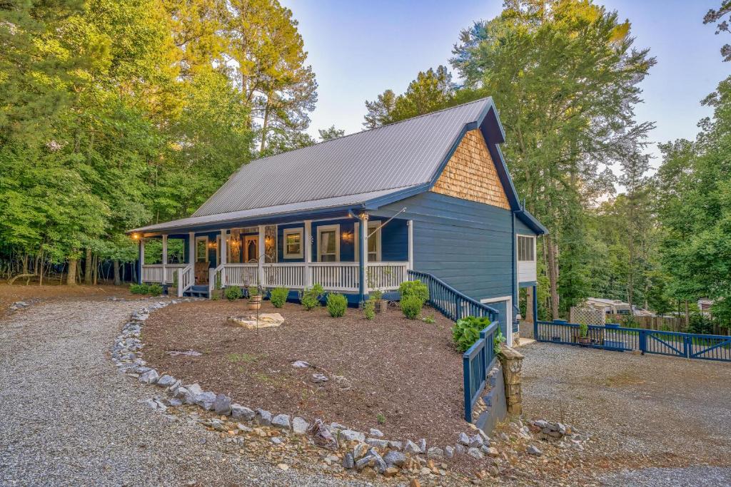 a blue house with a gambrel roof at Deer Run Retreat in Ellijay