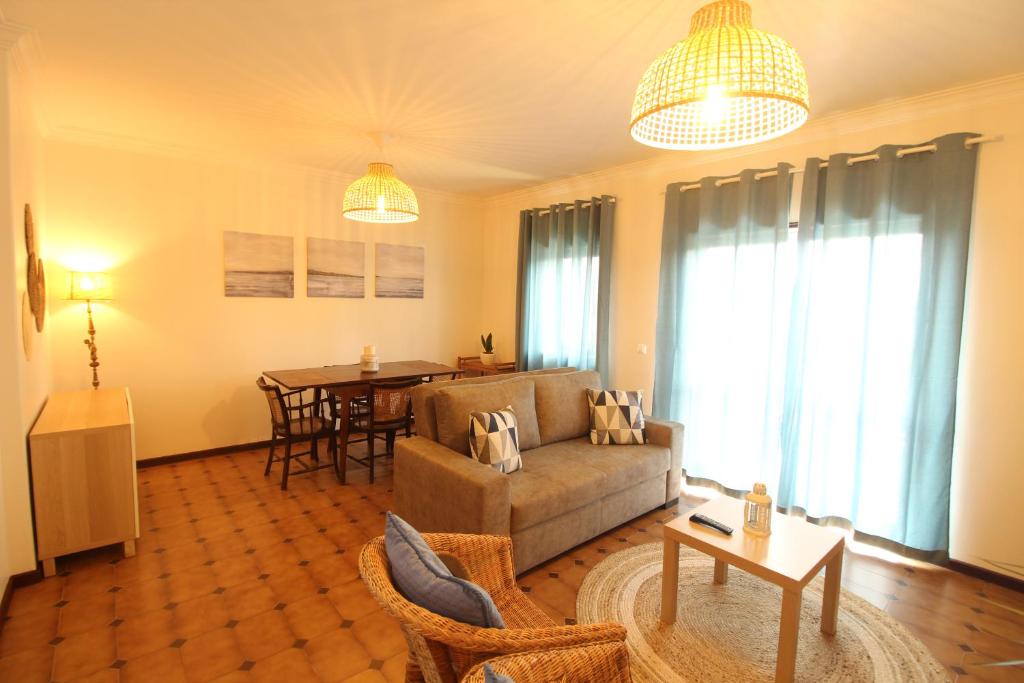 a living room with a couch and a table at Retorta do Pico - Alojamento Local in Caminha