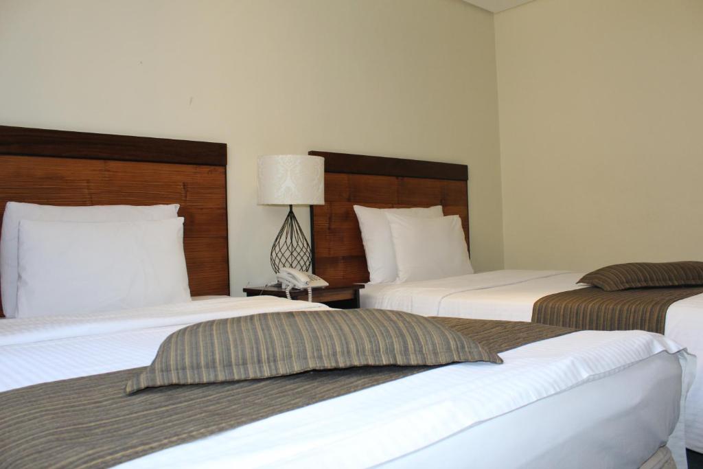 Postel nebo postele na pokoji v ubytování Boracay Sands Hotel