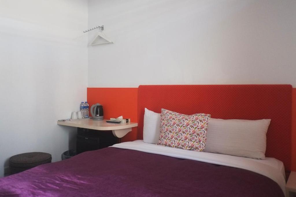 Postel nebo postele na pokoji v ubytování Ximen Hotel