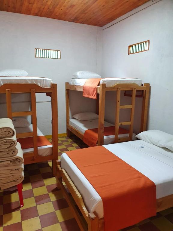 Postel nebo postele na pokoji v ubytování Hospedaje Campestre El Rancho de Jero