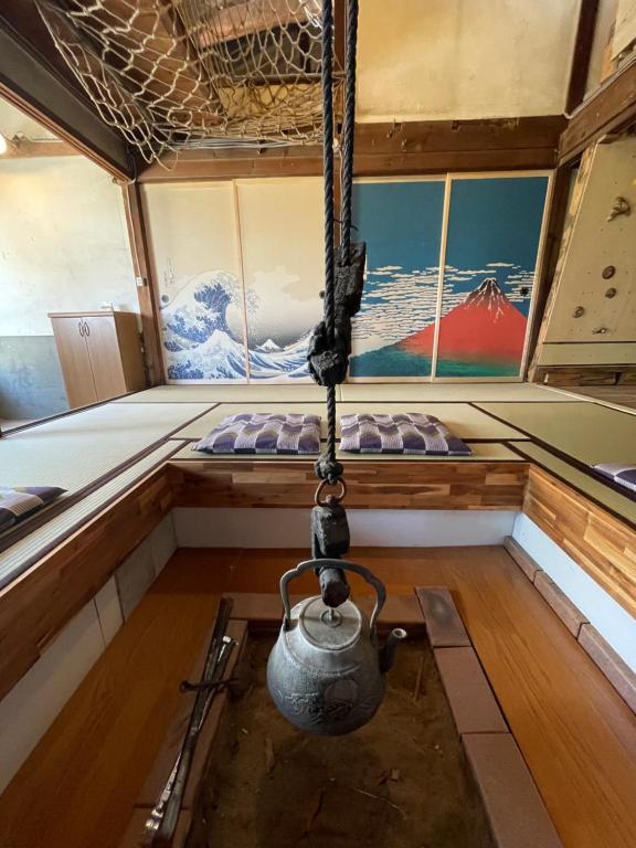 Postel nebo postele na pokoji v ubytování ゲストハウス餓鬼大将