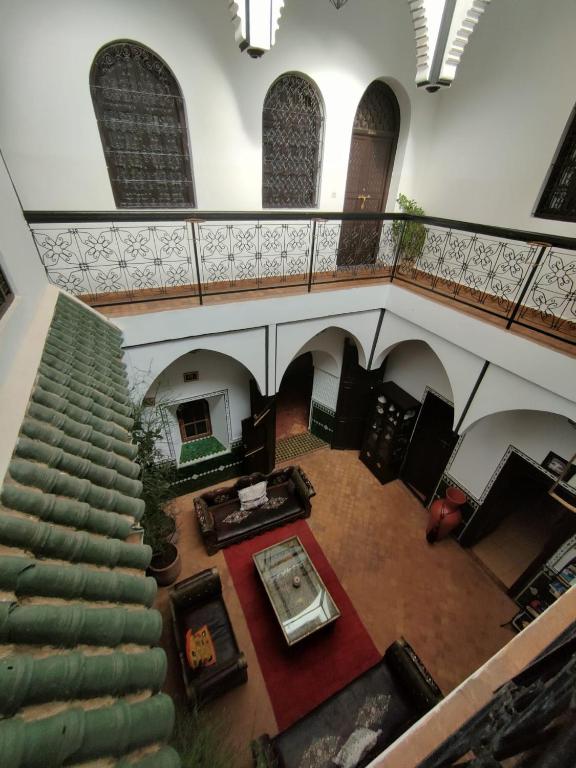 an overhead view of a spiral staircase in a building at Riad Assalam in Marrakech